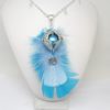 Bola de grossesse plumes bleues cage coeur ailes d'ange petits pieds feuilles perles en verre de Bohême bijou de grossesse argenté et bleu pièce unique réalisée sur mesure par Odacassie les créations de Cassandre bijoux et accessoires faits main