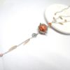 Bola de grossesse orange argenté or rose doré cage fleur feuilles perles plumes petits pieds bijou de grossesse pièce unique réalisée sur commande par Odacassie les créations de Cassandre bijoux et accessoires faits main bijoux poétiques bohèmes romantiques