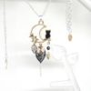 Collier chat noir et doré, étoiles, lune, feuilles, sequin doré et perle en verre de Bohême création Odacassie bijoux et accessoires faits main