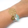 Bracelet estampes fleurs losange étoilé feuilles perles en verre de Bohême doré argenté bleu lagon turquoise vert menthe blanc bracelet attrape-rêves édition limité par Odacassie les créations de Cassandre bijoux et accessoires faits main bijoux poétiques bohèmes romantiques idée cadeau femme adolescente cérémonie mariage