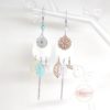 Boucles d'oreilles nacre blanche naturelle gouttes estampes feuilles oiseaux origami et arabesques perles en verre de Bohême coloris au choix or rose et blanc ou argenté vert d'eau et vert émeraude crochets d'oreilles chaîne et apprêts en acier inoxydable bijou édition très limitée par Odacassie les créations de Cassandre bijoux et accessoires faits main bijoux poétiques bijoux bohèmes bijoux romantiques idée cadeau femme idée cadeau fête des mères