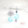 Boucles d'oreilles chats turquoise clair argente fleur de lotus estampes perle acier inoxydable par Odacassie