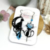 Boucles d'oreilles chats asymétriques bleu turquoise noir par Odacassie