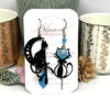 Boucles d'oreilles chats asymétriques bleu turquoise noir par Odacassie